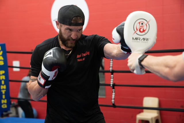 The intensity heats up as John Cantrell works on fast succession hits on the pads held by trainer Damon Reed.