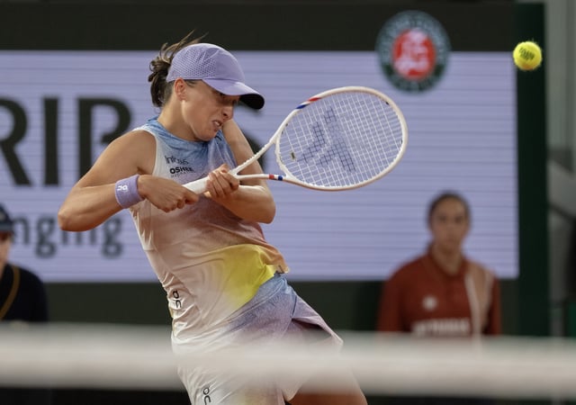 Jun 5, 2025; Paris, FR; Iga Swiatek of Poland returns a shot during her match against Aryna Sabalenka on day 12 at Roland Garros Stadium. Mandatory Credit: Susan Mullane-Imagn Images/File Photo