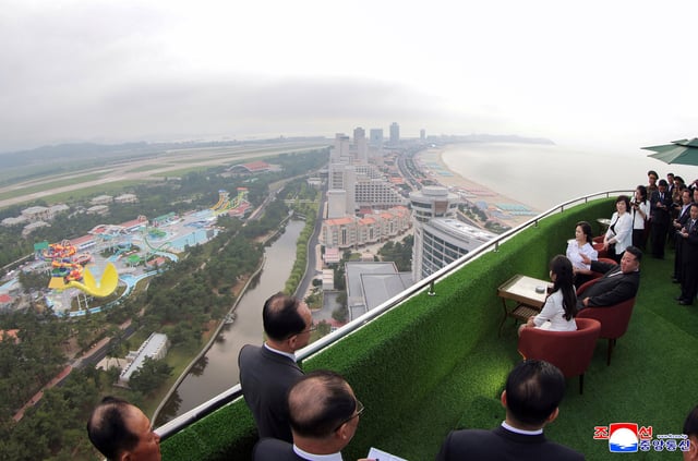 In this photo provided by the North Korean government, North Korean leader Kim Jong Un, sitting centre, with his wife Ri Sol Ju, rear, and daughter tours the Wonsan-Kalma coastal tourist zone in North Korea Tuesday, June 24, 2025.