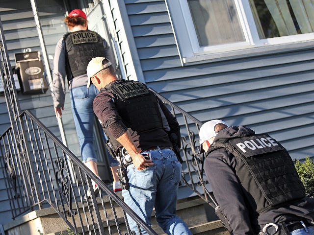 ICE agents make there way into a house where illegal aliens are staying with criminal backgrounds on September 25, 2019 in Revere, Massachusetts. (Matt Stone/MediaNews Group/Boston Herald via Getty)