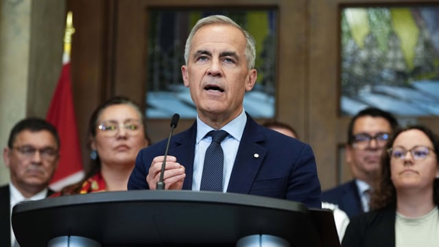Prime Minister Mark Carney is joined by members of his cabinet and caucus as he speaks at a news conference in the Foyer of the House of Commons in Ottawa on Friday, June 20, 2025, after Bill C-5 passed in the House. THE CANADIAN PRESS/Justin Tang