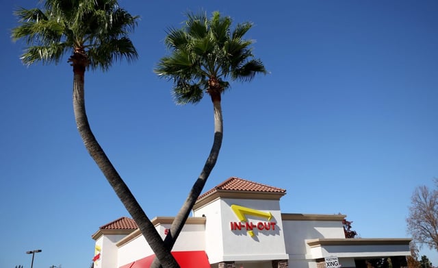 A restaurant in Pleasant Hill displays the In-n-Out Burger logo. (Photo by Justin Sullivan/Getty Images)