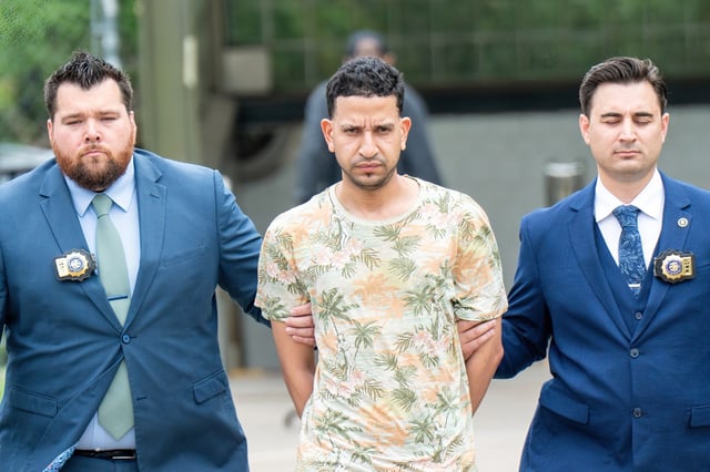 Edward Vargas, who allegedly pepper-sprayed a woman and her baby on a Queens subway train, is pictured in police custody leaving the NYPD&#39;s Transit District 20 in Queens, New York, on Thursday, June 26, 2025. (Theodore Parisienne / New York Daily News)
