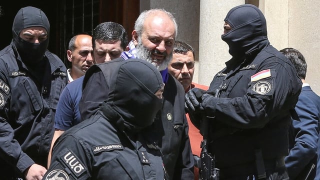 Archbishop of the Armenian Apostolic Church Bagrat Galstanyan is seen being taken away by Armenian authorities. Galstanyan holds citizenship in both Armenia and Canada.