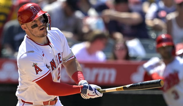 Angels star Mike Trout hits an RBI single during the sixth inning of their game against the Boston Red Sox on Wednesday afternoon at Angel Stadium. (AP Photo/Jayne Kamin-Oncea)