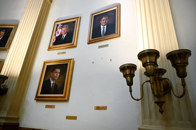 A blank wall and small plaque are all that remain next to other presidential portraits where a portrait of President Donald Trump used to hang on the third floor of the Colorado State Capitol in Denver on April 7, 2025. Trump said he disliked the portrait of himself and called out Colorado Gov. Jared Polis about it on a social media post. (Photo by Helen H. Richardson/The Denver Post)
