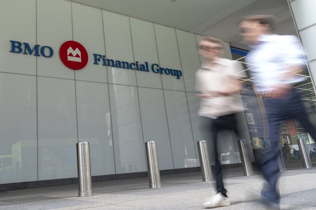 People make their way past the Bank of Montreal (BMO) building in the Financial District of Toronto, Monday Aug. 14, 20243. THE CANADIAN PRESS/Spencer Colby