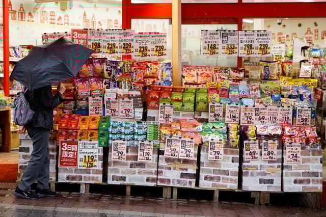 A woman looks at items at a shop in Tokyo, Japan, March 24, 2023. REUTERS/Androniki Christodoulou
