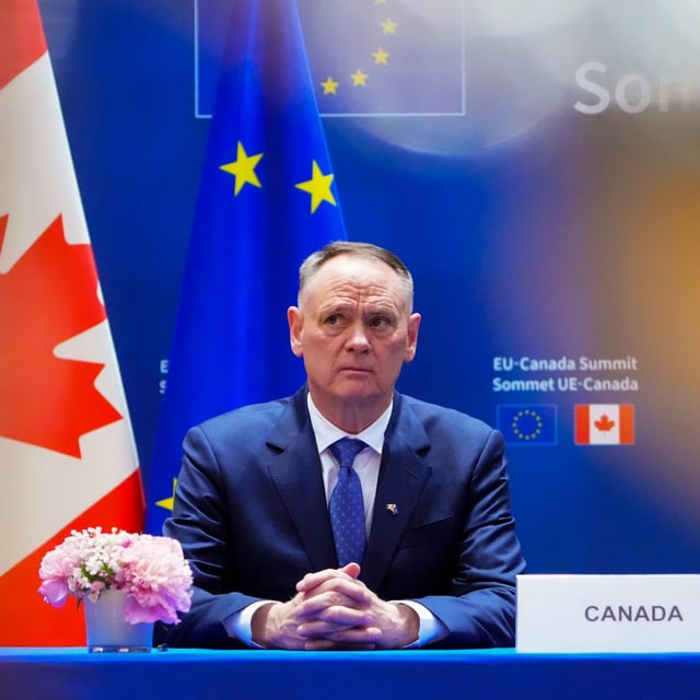 Minister of National Defence David McGuinty takes part in a signing ceremony at the Canada-EU Summit in Brussels, Belgium on Monday, June 23, 2025.  THE CANADIAN PRESS/Sean Kilpatrick