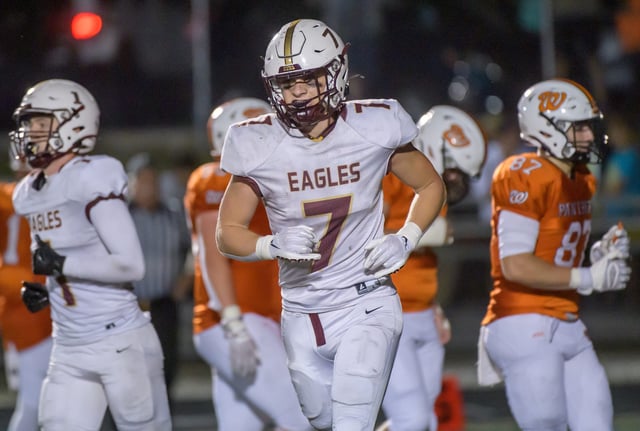 Dunlap's Mack Sutter comes off the field after an Eagles touchdown against Washington late in the second half of their Week 7 high school football game Friday, Oct. 11, 2024 at Babcook Field in Washington. The Panthers defeated the Eagles 31-10.