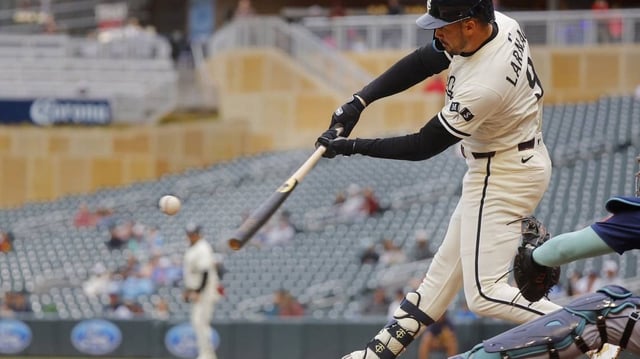 Jun 26, 2025; Minneapolis, Minnesota, USA; Minnesota Twins designated hitter Trevor Larnach (9) hits a two run home run against the Seattle Mariners in the fifth inning at Target Field. Mandatory Credit: Bruce Kluckhohn-Imagn Images