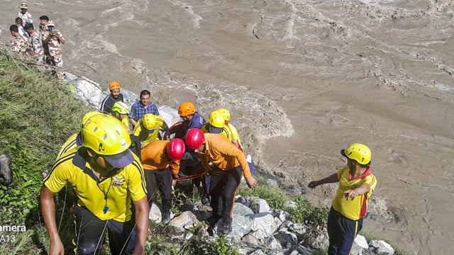Rudraprayag: SDRF personnel carry out rescue work after a tempo traveller carrying pilgrims fell into the Alaknanda River, in Rudraprayag district, Uttarakhand, Thursday, June 26, 2025. At least two people were killed and eight injured in the accident.