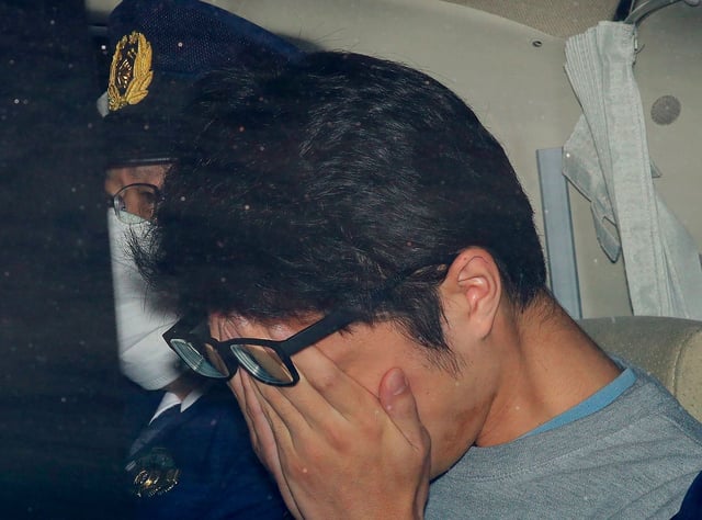 Takahiro Shiraishi leaves a police station in Hachioji, suburbs of Tokyo, in November 2017.