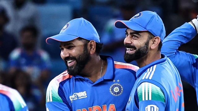 India's Rohit Sharma (L) and his teammate Virat Kohli (R) celebrate