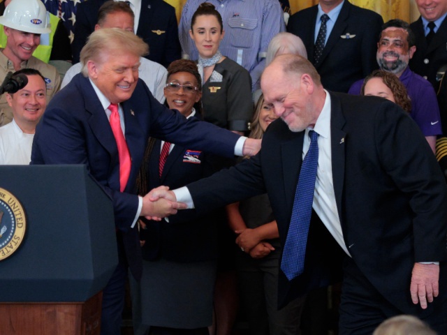 U.S. President Donald Trump shakes hands with his Border Czar Tom Homan during a "One, Big, Beautiful" event in the East Room of the White House on June 26, 2025 in Washington, DC. Trump held an event to urge the passage of the "One, Big, Beautiful Bill," Trump's signature tax-and-spending agenda. (Photo by Chip Somodevilla/Getty Images)