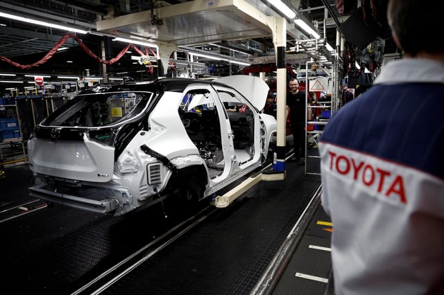 Employees work on the Yaris Cross car assembly line at the Toyota Motor Manufacturing France (TMMF) plant in Onnaing near Valenciennes, France, April 4, 2024. REUTERS/Benoit Tessier/File Photo