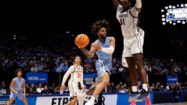 Mar 18, 2025; Dayton, OH, USA; North Carolina Tar Heels guard RJ Davis (4) plays the ball defende day San Diego State Aztecs forward Jared Coleman-Jones (31) in the second half at UD Arena. Mandatory Credit: Rick Osentoski-Imagn Images