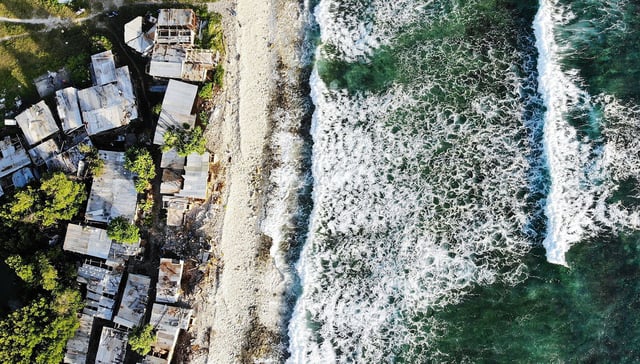 An aerial view of homes next to the Pacific Ocean, in Funafuti, Tuvalu, on November 28, 2019.