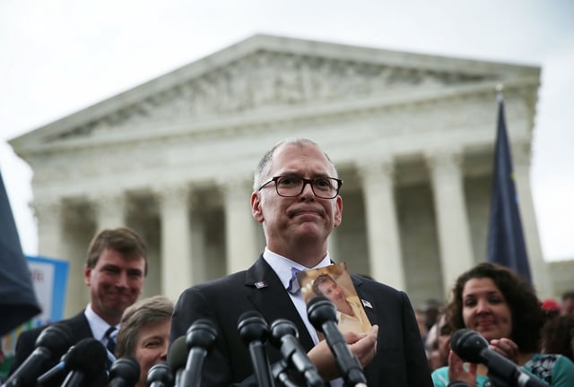 WASHINGTON, DC - JUNE 26:  Plaintiff Jim Obergefell holds a photo of his late husband John Arthur as he speaks to members of the media after the U.S. Supreme Court handed down a ruling regarding same-sex marriage June 26, 2015 outside the Supreme Court in Washington, DC. The high court ruled that same-sex couples have the right to marry in all 50 states.  (Photo by Alex Wong/Getty Images)