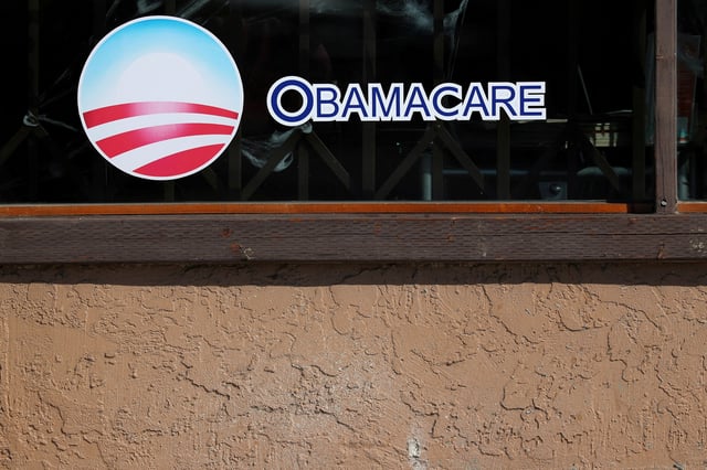 A sign on an insurance store advertises Obamacare in San Ysidro, San Diego, California, U.S., October 26, 2017. REUTERS/Mike Blake/File Photo