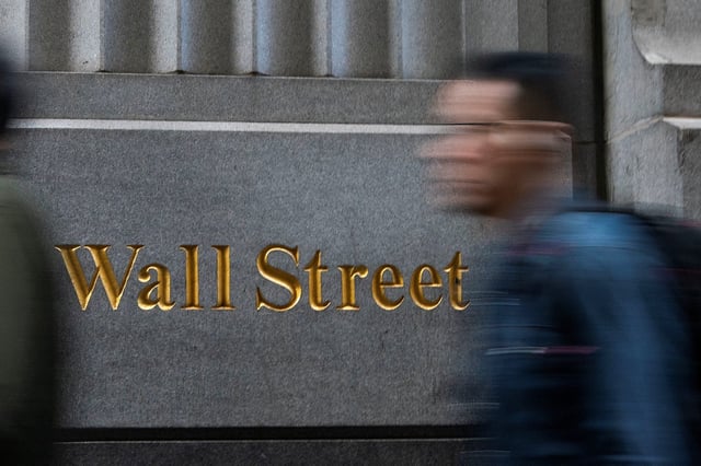 People walk around the New York Stock Exchange in New York, U.S., December 29, 2023. REUTERS/Eduardo Munoz
