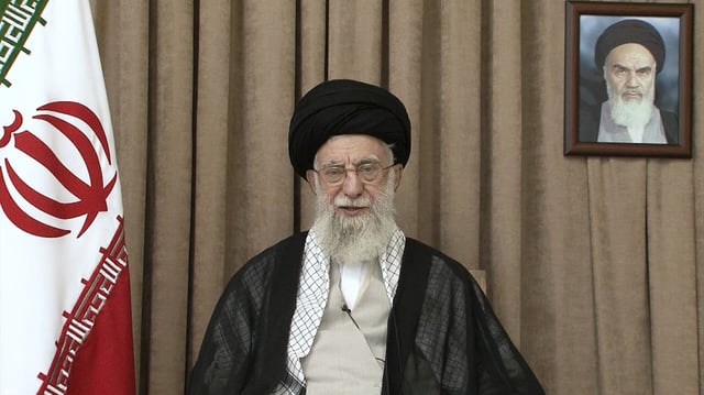 In this photo released on Thursday, June 26, 2025, by the official website of the office of the Iranian supreme leader, Supreme Leader Ayatollah Ali Khamenei speaks in a televised speech, under a portrait of the late revolutionary founder Ayatollah Khomeini.