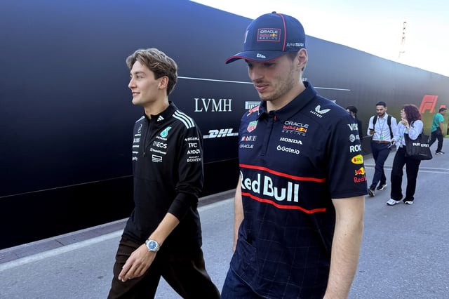 Image shot on mobile device) Race winner George Russell of Great Britain and Mercedes AMG Petronas F1 Team and Second placed Max Verstappen of the Netherlands and Oracle Red Bull Racing walk back from the Stewards Office during the F1 Grand Prix of Canada at Circuit Gilles-Villeneuve on June 15, 2025 in Montreal, Quebec.