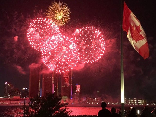True North strong and free: Downtown Windsor's Great Canadian Flag flies as red-and-white fireworks explode over the Detroit River during the Ford Fireworks show on Monday, June 23, 2025.