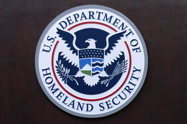 The seal of U.S. Department of Homeland Security is seen before the news conference.