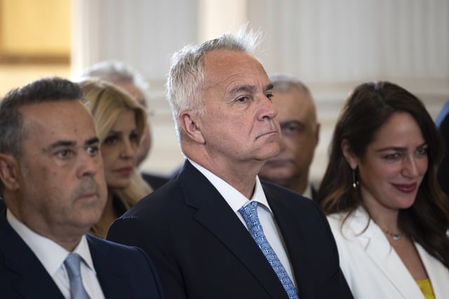 FILE- Greece's Minister of Migration Makis Voridis, centre, attends a swearing in ceremony at the Presidential palace, in Athens, Greece, on March 15, 2025. (AP Photo/Yorgos Karahalis, File)