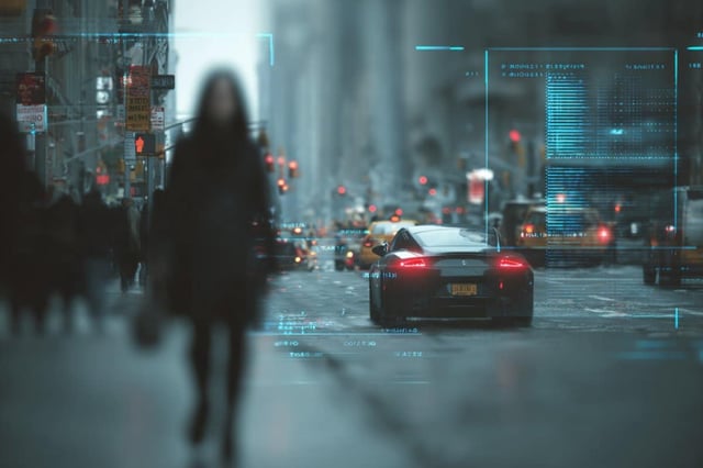 The model also helps make sense of what’s sometimes considered a “human quirk”: the ability to make perceptions of non-task-oriented objects — such as the billboard or the sports car — disappear while crossing the busy street. Credit: Neuroscience News