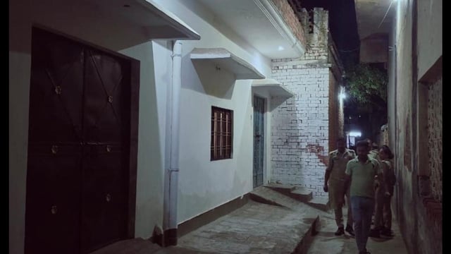 Police personnel during the raid at the house of the accused in Malihabad late on Thursday night. (HT Photo)