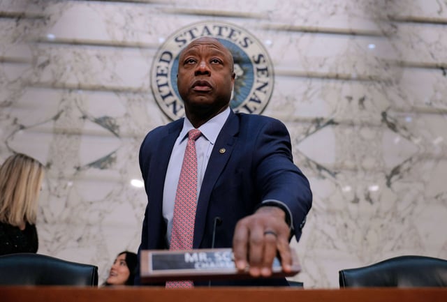 Senate Banking Committee Chair Tim Scott arrives for a hearing in the Hart Senate Office Building on Capitol Hill on February 11, 2025, in Washington, D.C.
