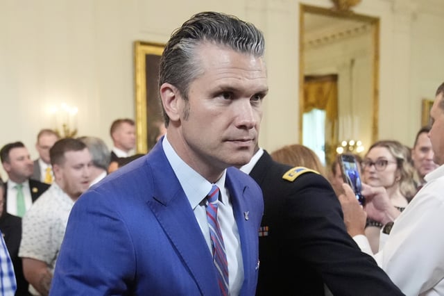 Defense Secretary Pete Hegseth departs an event to promote President Donald Trump's domestic policy and budget agenda in the East Room of the White House, Thursday, June 26, 2025, in Washington. (AP Photo/Mark Schiefelbein)