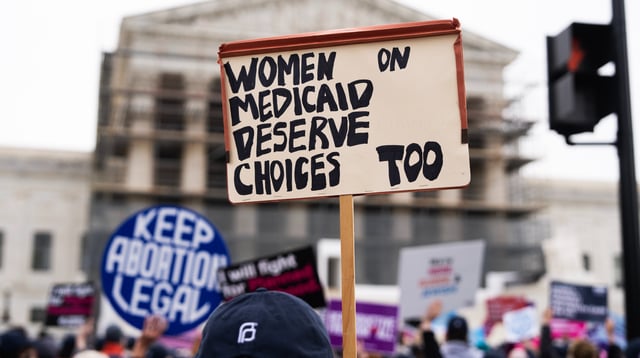 UNITED STATES - APRIL 2: A pro-choice demonstrator holds a sign in front of the U.S. Supreme Court as the Medina v. Planned Parenthood South Atlantic case is heard on Wednesday, April 2, 2025. 