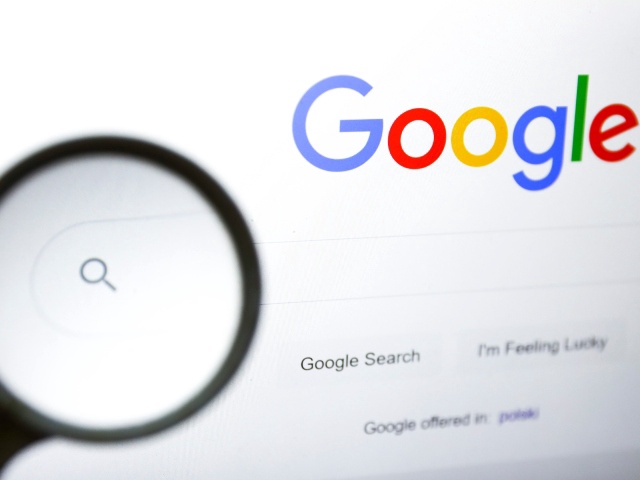 A magnifying glass is photographed with Google logo displayed on a laptop screen for illustration photo. Gliwice, Poland on January 23, 2022. (Photo by Beata Zawrzel/NurPhoto)