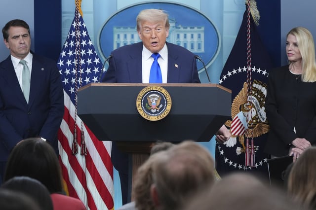 President Donald Trump speaks to the media as Attorney General Pam Bondi, right, and Deputy Attorney General Todd Blance, left, listen, Friday, June 27, 2025, in the briefing room of the White House in Washington. (AP Photo/Jacquelyn Martin)
