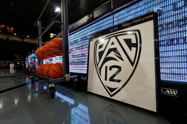 The PAC-12 logo is displayed on a traction mat in the Events Center before the final conference regular-season NCAA college basketball game Sunday, March 3, 2024, in Boulder, Colo. (AP Photo/David Zalubowski)