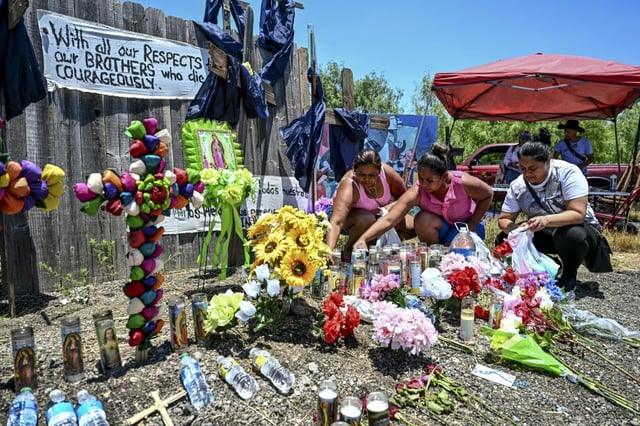 A makeshift memorial to migrants who died in a tractor-trailer outside San Antonio, Texas, in June 2022