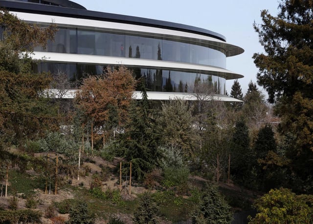 The Apple Park headquarters building is visible from the roof of the visitor center in Cupertino. Apple spent $517 million this week to buy office campuses in Sunnyvale and Cupertino, reinforcing its deepening presence in Silicon Valley.