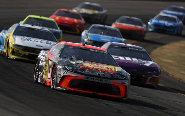 Jun 22, 2025; Long Pond, Pennsylvania, USA; NASCAR Cup Series driver Chase Briscoe (19) leads a pack of cars during The Great American Getaway 400 at Pocono Raceway. Mandatory Credit: Matthew O'Haren-Imagn Images/File Photo