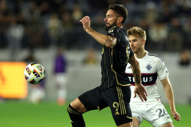 Los Angeles FC forward Olivier Giroud (9) chases the ball against Vancouver Whitecaps midfielder Stuart Armstrong during the second half of Game 1 of the MLS Cup Playoffs Round One at BMO Stadium in Los Angeles on Sunday, Oct. 27, 2024.  Los Angeles FC won 2-1.  (Photo by Raul Romero Jr., Contributing Photographer)