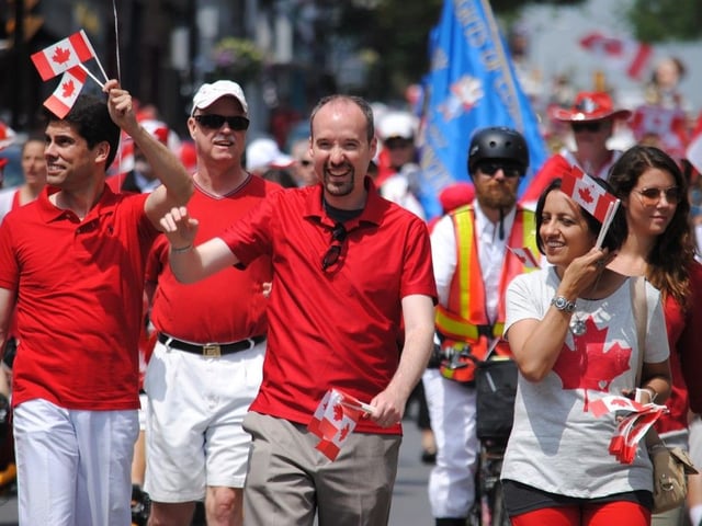 Kingston Mayor, Bryan Paterson leads a Canada Day Parade down Princess Street in Kingston