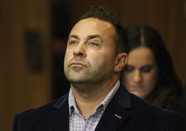 In this Oct. 15, 2014 file photo, Giuseppe &#34;Joe&#34; Giudice, from the television show &#34;Real Housewives of New Jersey,&#34; stands during a hearing in the Passaic County Courthouse in Paterson, N.J.