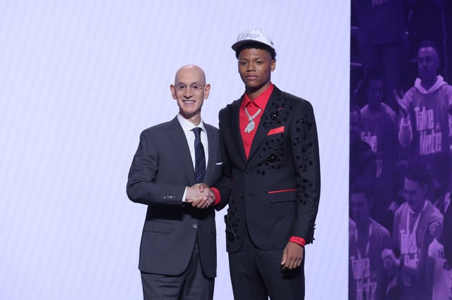 Jun 25, 2025; Brooklyn, NY, USA;  Ace Bailey stands with NBA commissioner Adam Silver after being selected as the fifth pick by the Utah Jazz in the first round of the 2025 NBA Draft at Barclays Center. Mandatory Credit: Brad Penner-Imagn Images