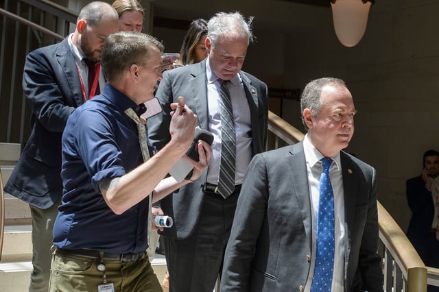 Sen. Tim Kaine, D-Va., center, and Sen. Adam Schiff, D-Calif., right, arrive for a classified briefing on President Donald Trump's directed strikes on Iranian nuclear facilities last weekend, at the Capitol in Washington, Thursday, June 26, 2025. (AP Photo/Rod Lamkey, Jr.)