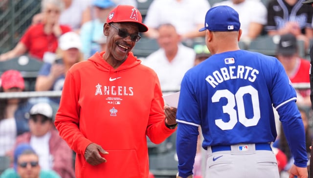 TEMPE, ARIZONA – FEBRUARY 24: Manager Ron Washington(L) of the Los Angeles Angels smiles against the Los Angeles Dodgers during a spring training game at the Peoria Sports Complex on February 24, 2024 in Tempe, Arizona. (Photo by Masterpress/Getty Images)
