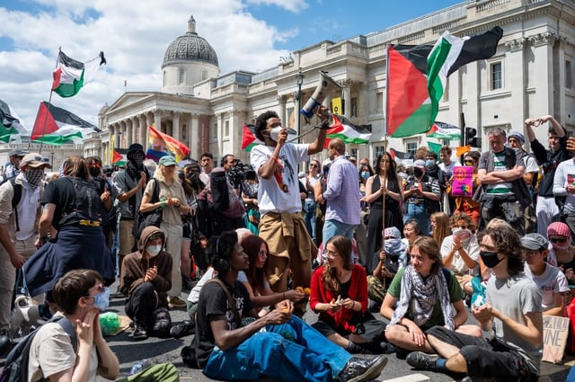 Palestine Action protestors at Trafalgar Square in London. (Picture: Ben Montgomery/Getty Images)