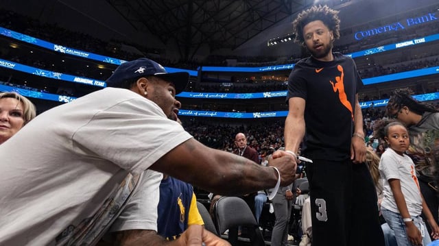 Dallas Cowboys linebacker Micah Parsons, left, greets Detroit Pistons forward Cade Cunningham, right, as they sit courtside during an WNBA game between the Dallas Wings and Indiana Fever at the American Airlines Center in Dallas on Friday, June 27, 2025.