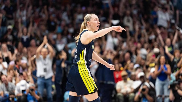 Dallas Wings guard Paige Bueckers reacts after hitting a 3-point shot at the halftime buzzer of a WNBA game between the Dallas Wings and Indiana Fever at the American Airlines Center in Dallas on Friday, June 27, 2025.